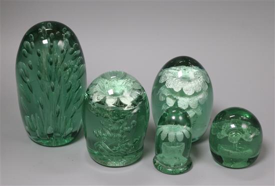 A collection of five green glass dumps